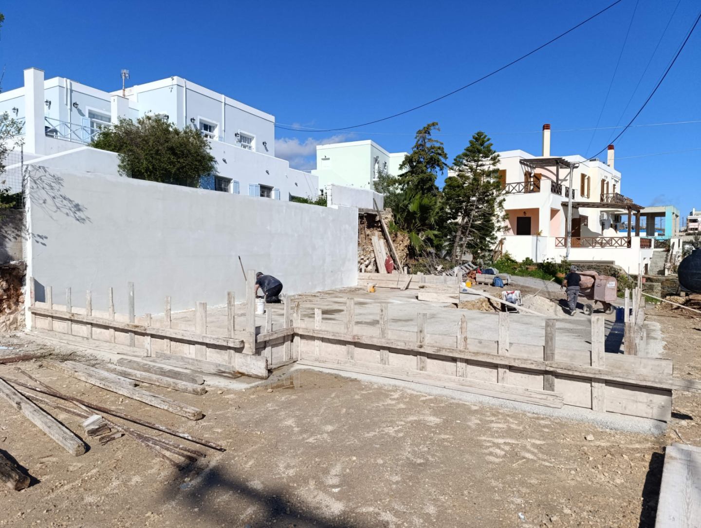The first foundation slab at the Navium Suites site in Azolimnos, Syros, Spring 2026.
