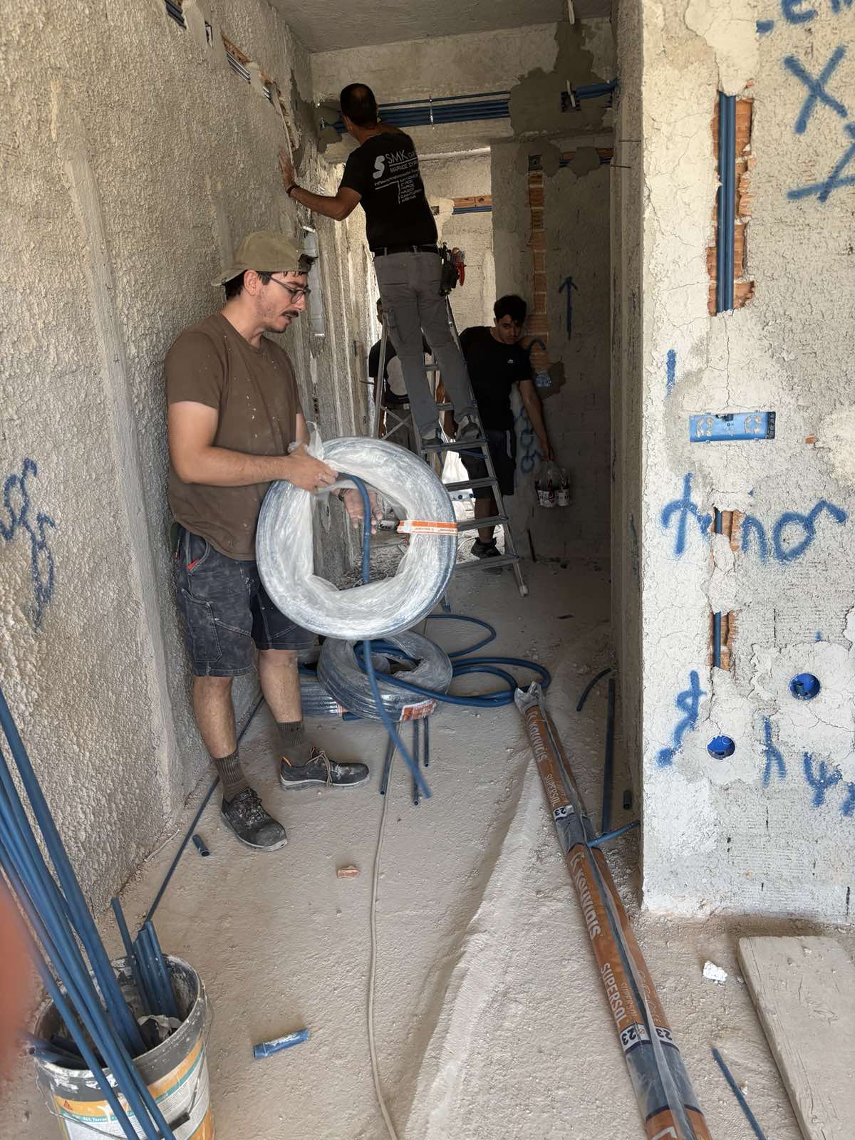 The Navium electrical crew at work during construction in Azolimnos, Syros.